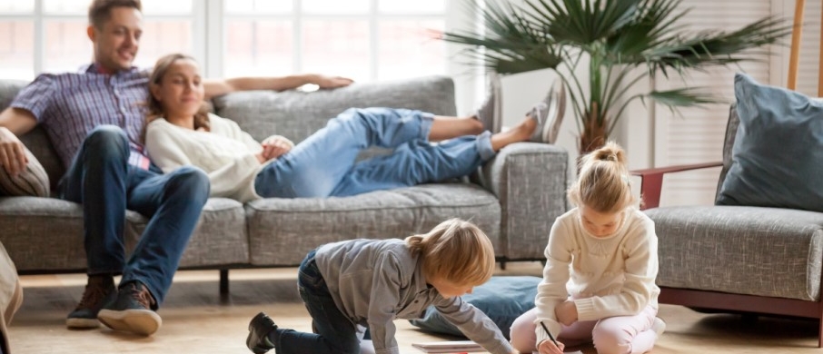 Family of four in living room 