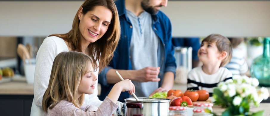 Family cooking dinner together 